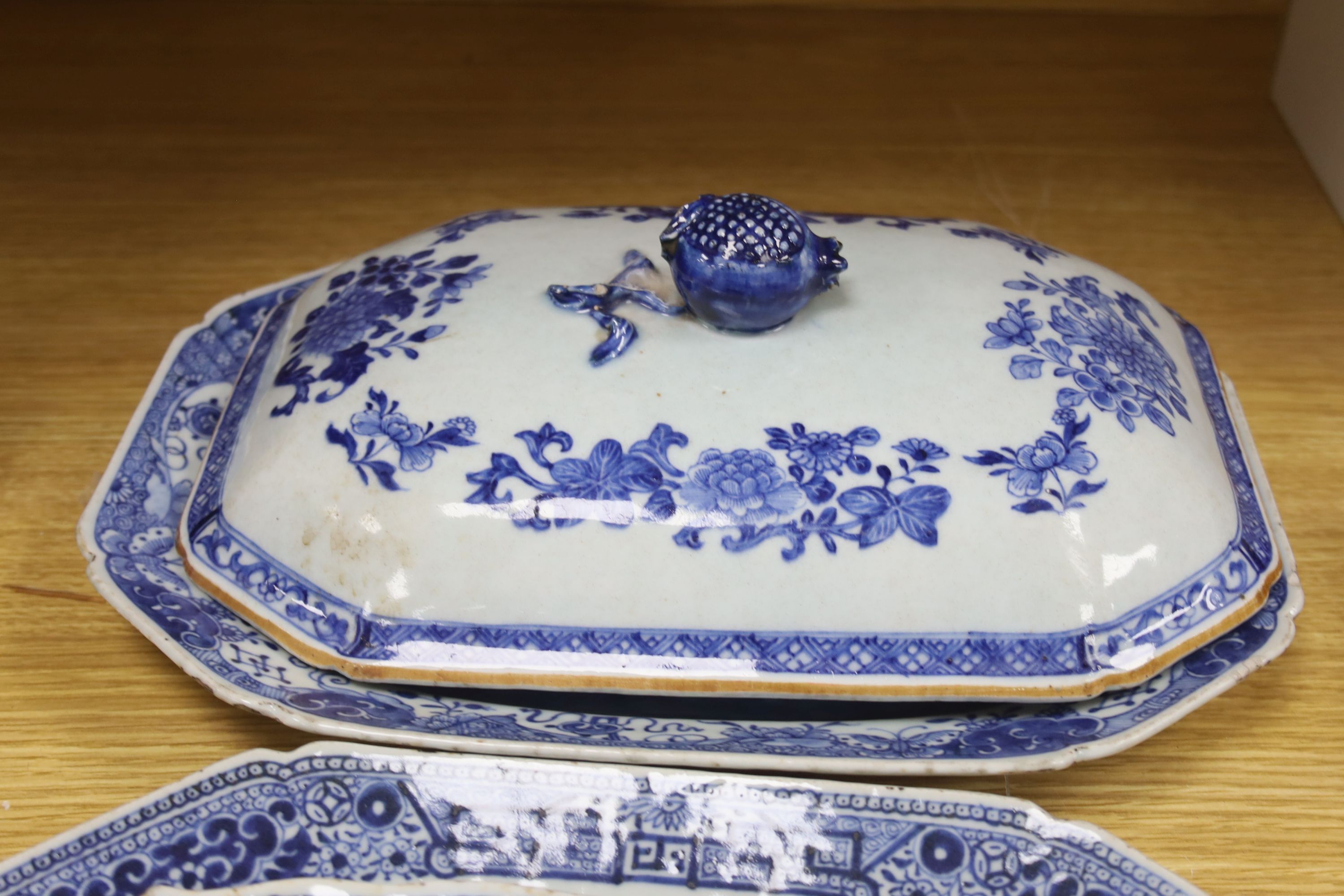 Three Chinese export blue and white meat dishes and a similar cover, Qianlong period, widest 33cm